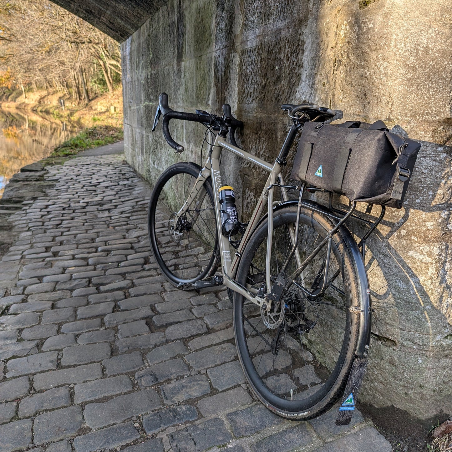 Wynd cycling trunk bag in use on adventure bike"
